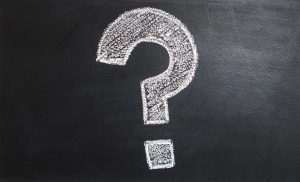 A question mark drawn on the side of a chalkboard.